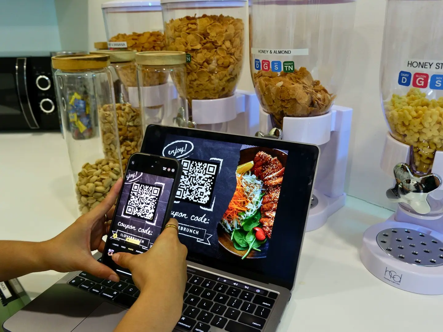 A person scanning a QR code on a restaurant table