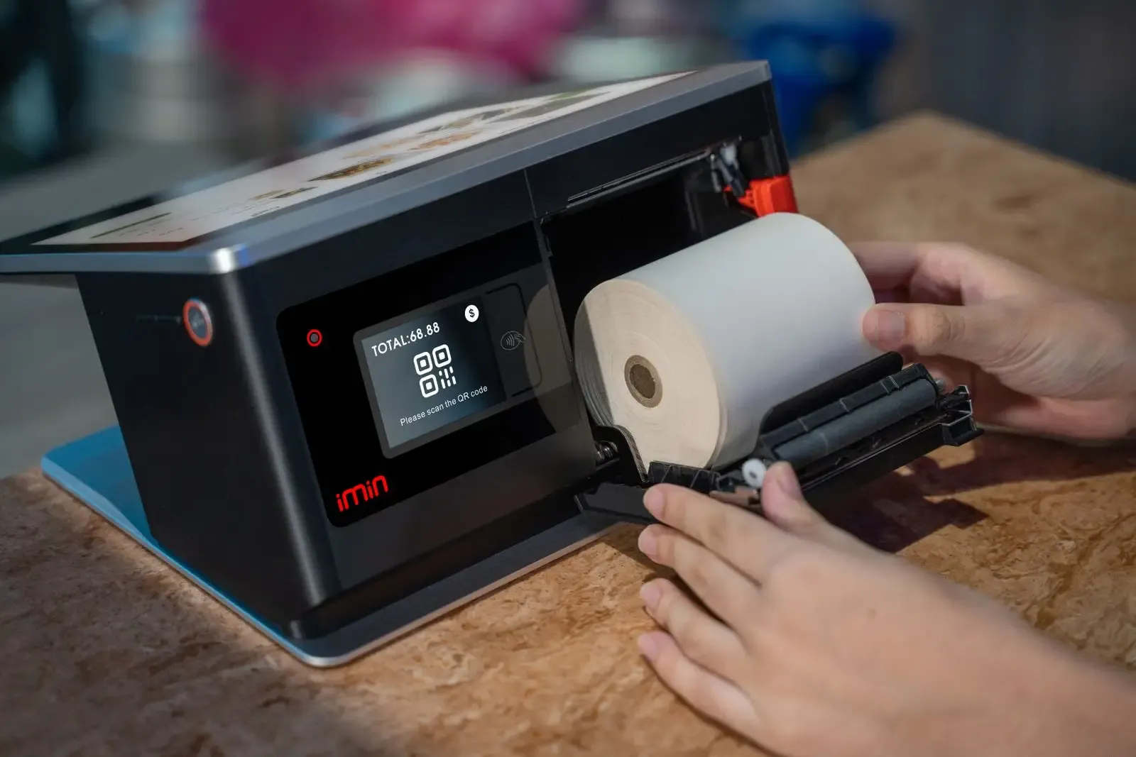 Hands passing a printed receipt